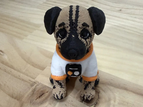 Front view of Astro Dog in a white astronaut-style suit with orange trim