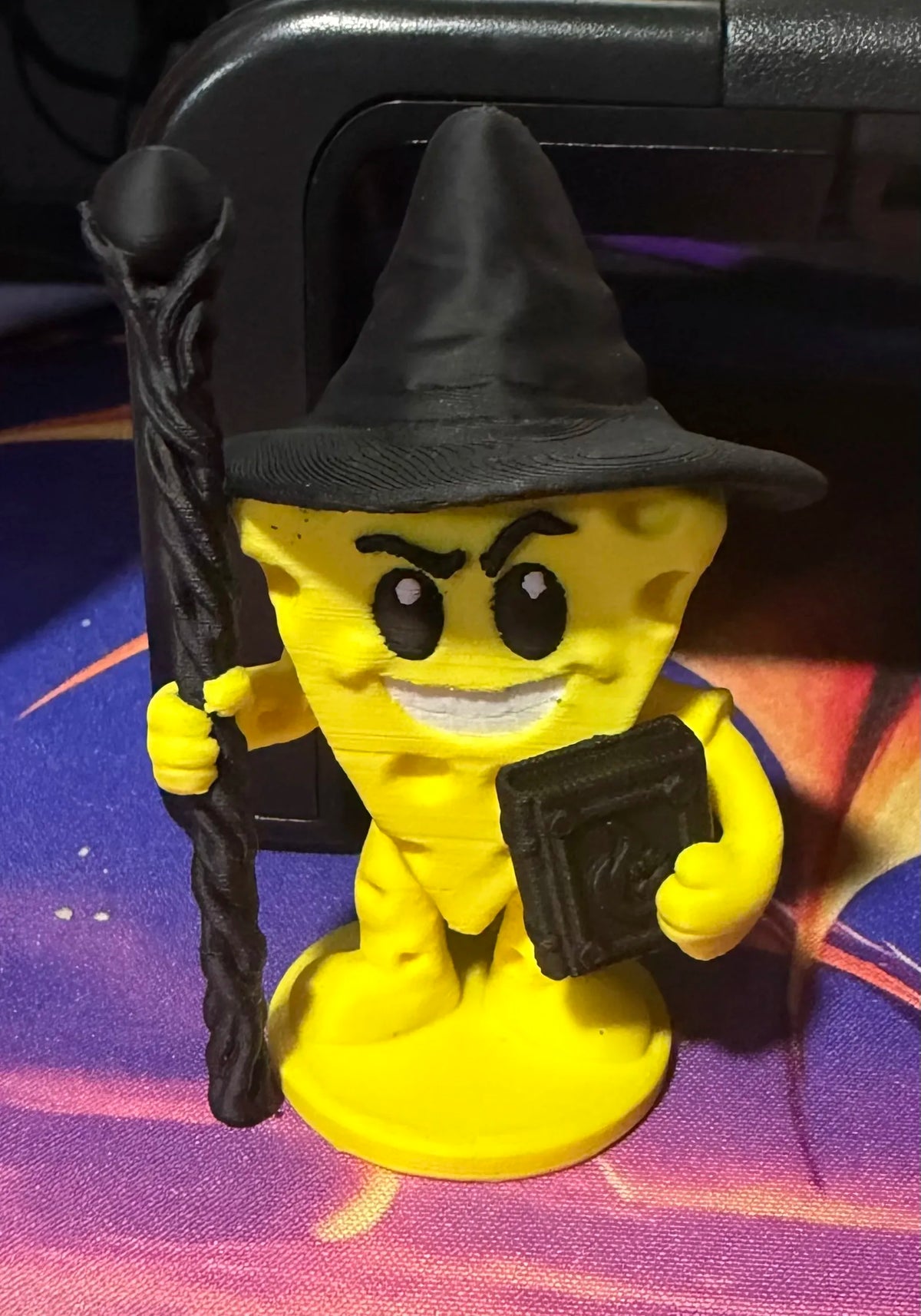 Cheezy Dark Wizard figure with pointed hat, staff, and open book