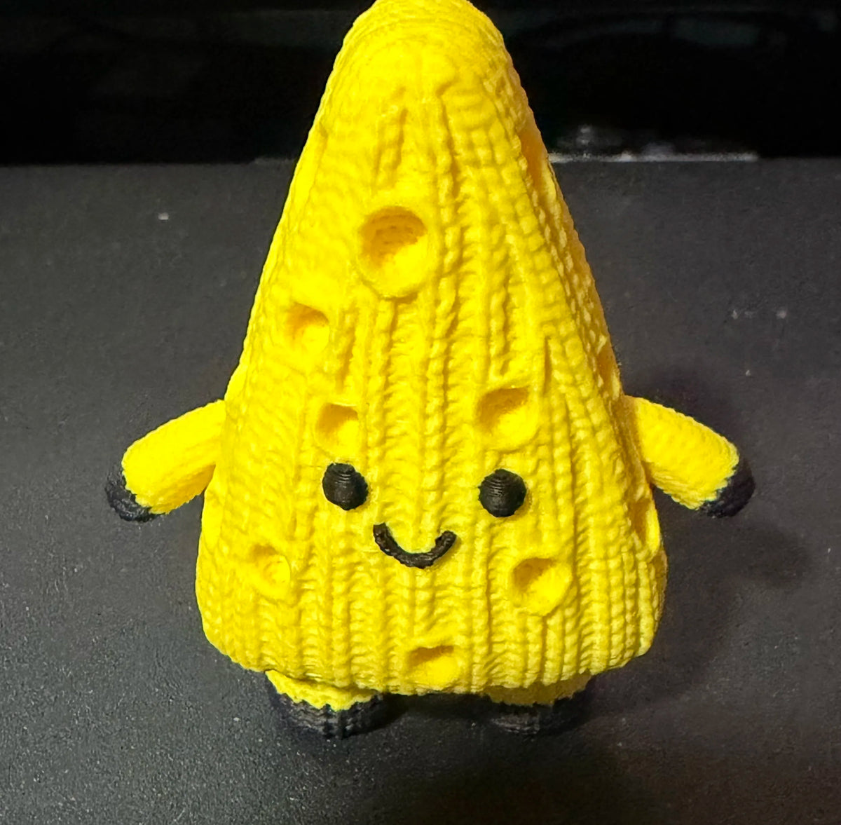 Cheezy Knitted Cheese figure with an all-over cable-knit texture